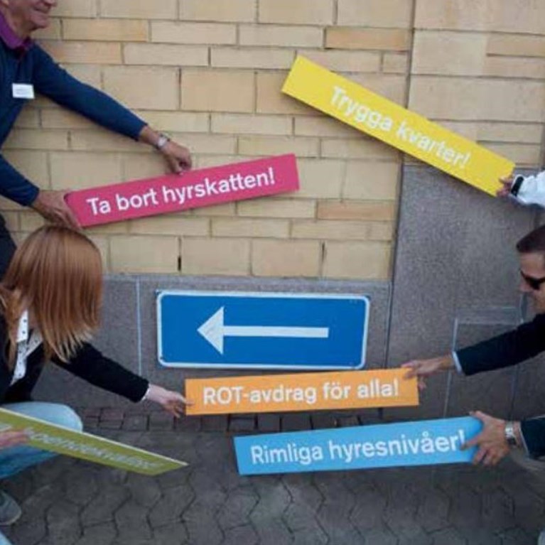 Bilden visar olika skyltar rot, rimliga hyresnivåer och trygga kvarter